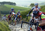 Riders scramble up a tricky section 